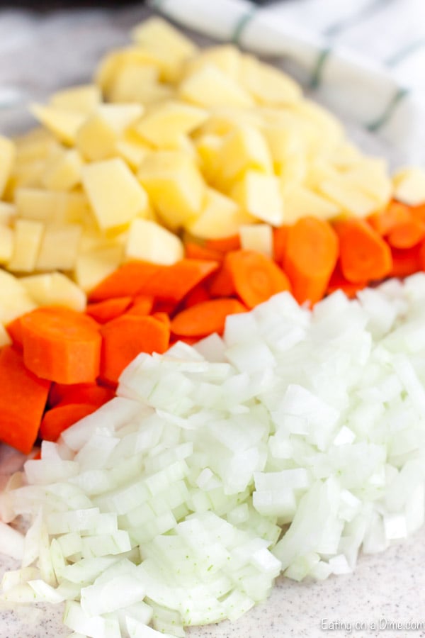 Chopping potatoes, carrots, and onion for the stew