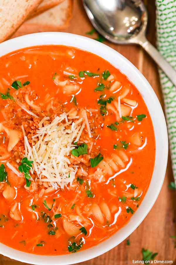 Enjoy everything you love about Chicken Parm in this easy Crock Pot Creamy Chicken Parmesan Soup Recipe. Each bite is loaded with flavor and easy to make. 