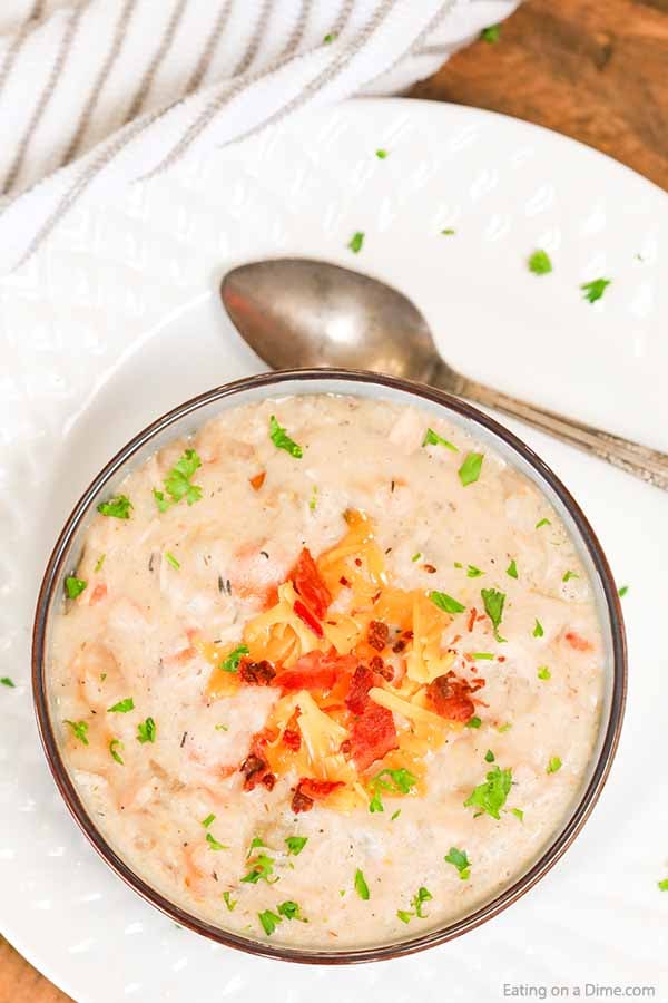 Crock pot potato soup with chicken is creamy and loaded with flavor. If you love potato soup, chicken and potato soup will be a hit. The crockpot makes it easy. Slow Cooker baked potato soup is cheesy and easy. #eatingonadime #crockpotpotatosoupwithchicken