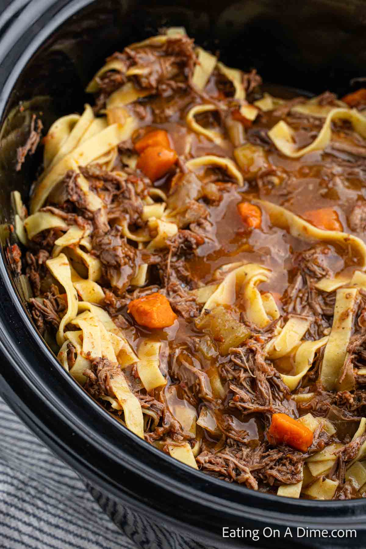 Close up image of beef ragu in the slow cooker