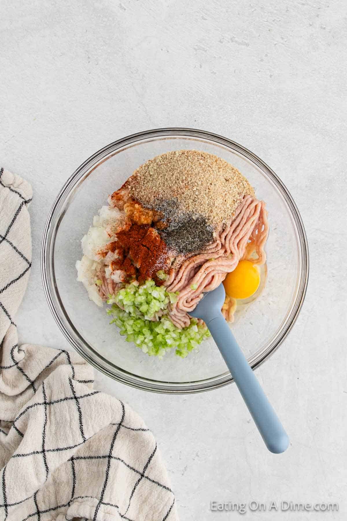 Combining ingredients in a bowl with a spatula