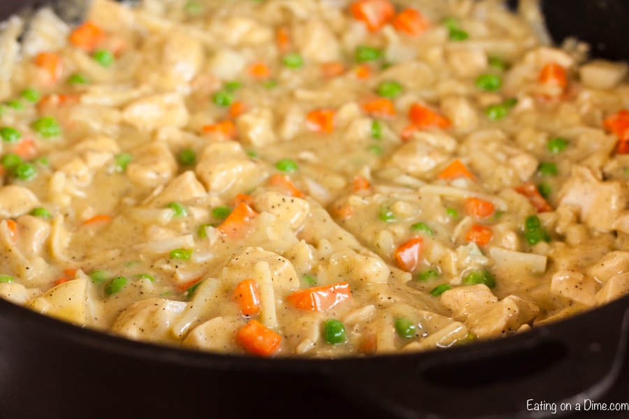 Close up image of chicken mixture in iron skillet. 