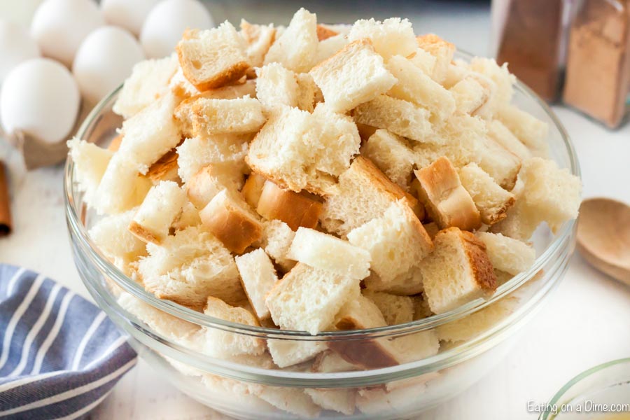 Diced up bread in a large mixing bowl.  