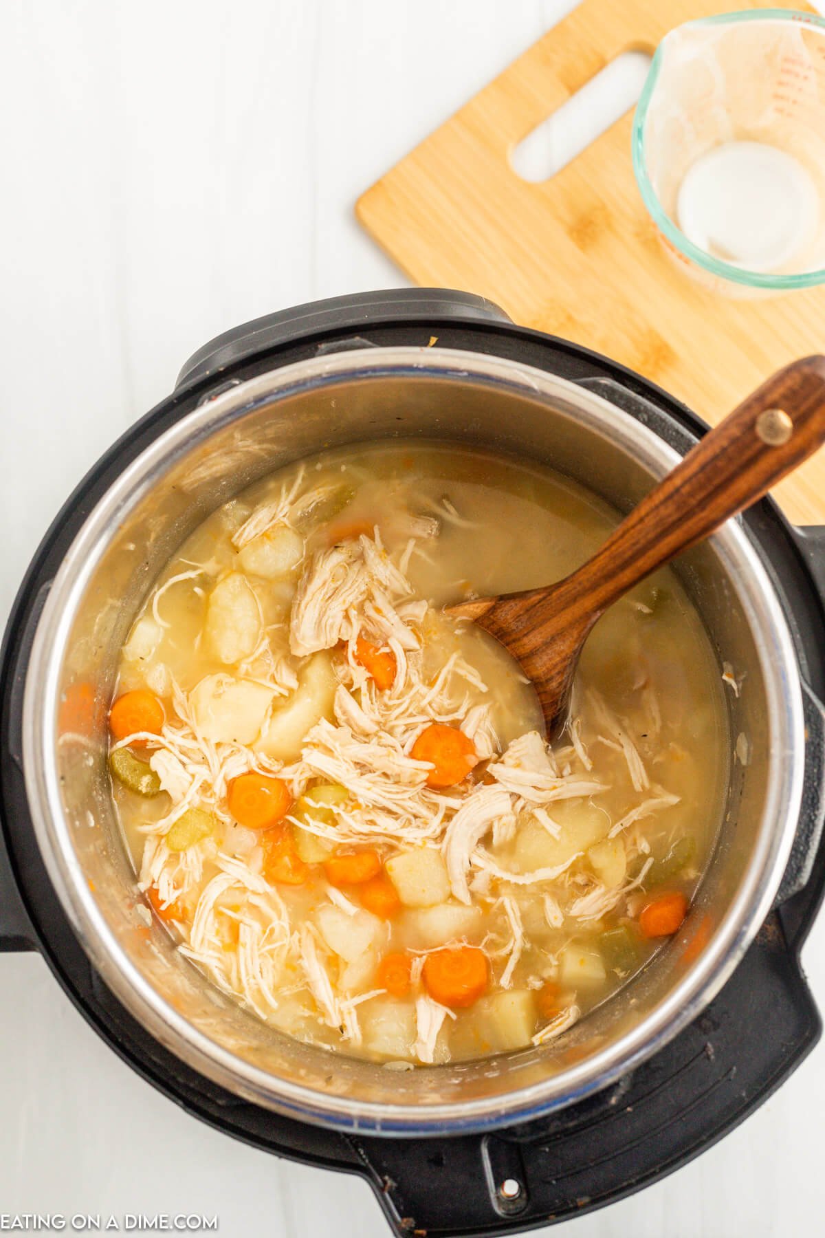 Adding the cornstarch slurry to the soup