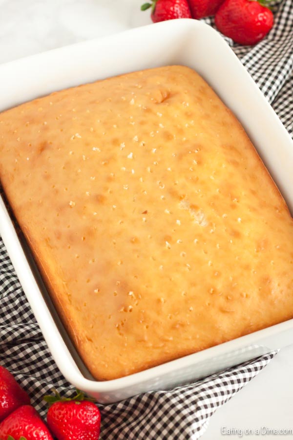 Close up image of white cake mix in a cake pan.