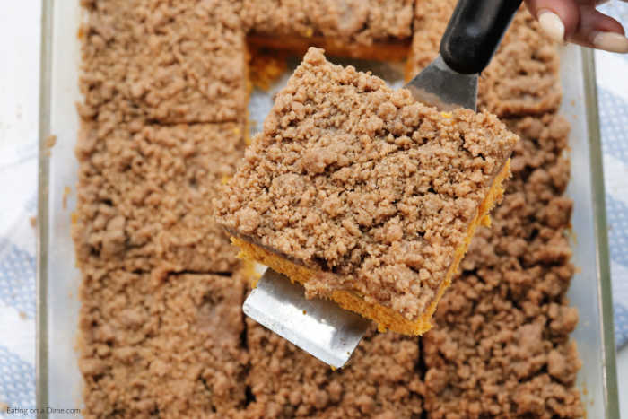 This Pumpkin Coffee Cake Recipe is going to be a hit! Cake mix paired with pumpkin and streusel topping creates a delicious cake for breakfast or dessert. 