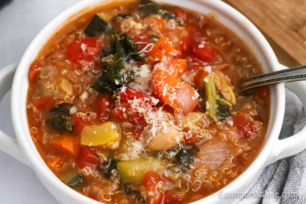 Quinoa Soup in a white bowl with a spoon
