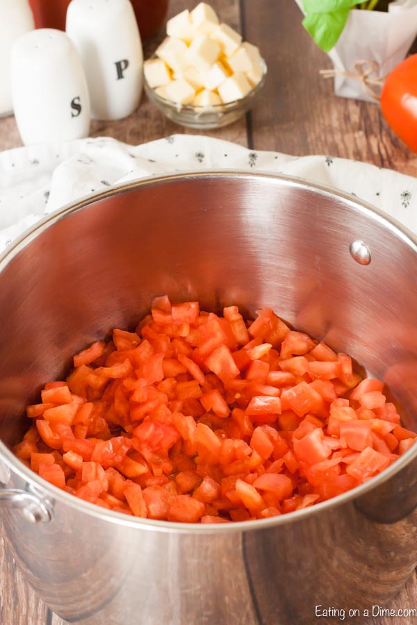 Diced tomatoes in stock pot.