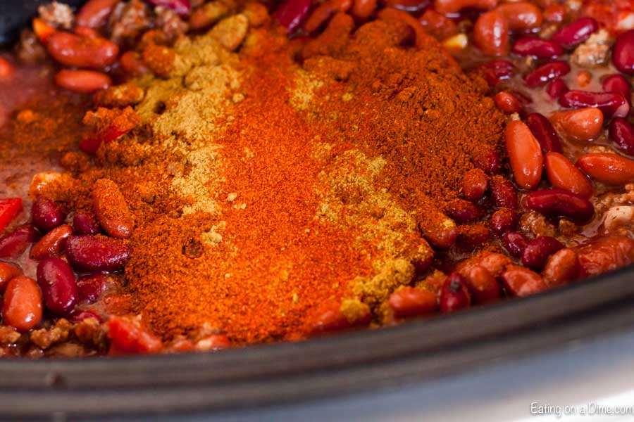 The ingredients for this cowboy chili in a crock pot ready to cook. 