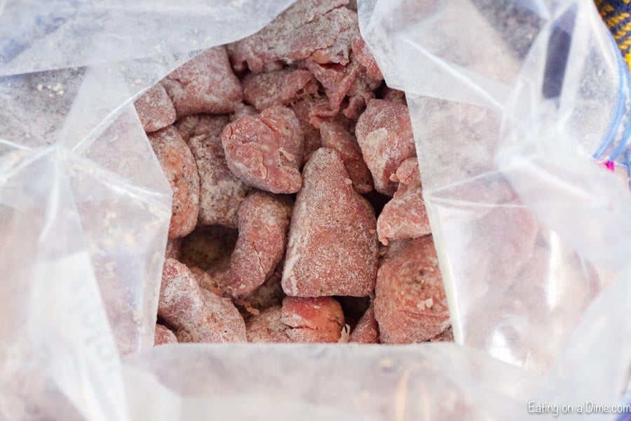 Stew meat in bag coated with flour.