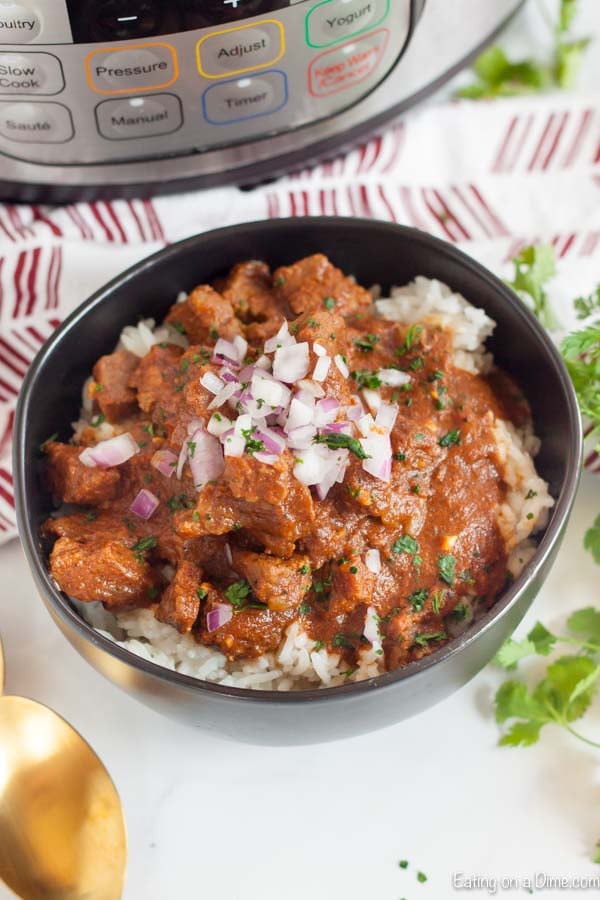 Beef Curry in a black bowl over white rice