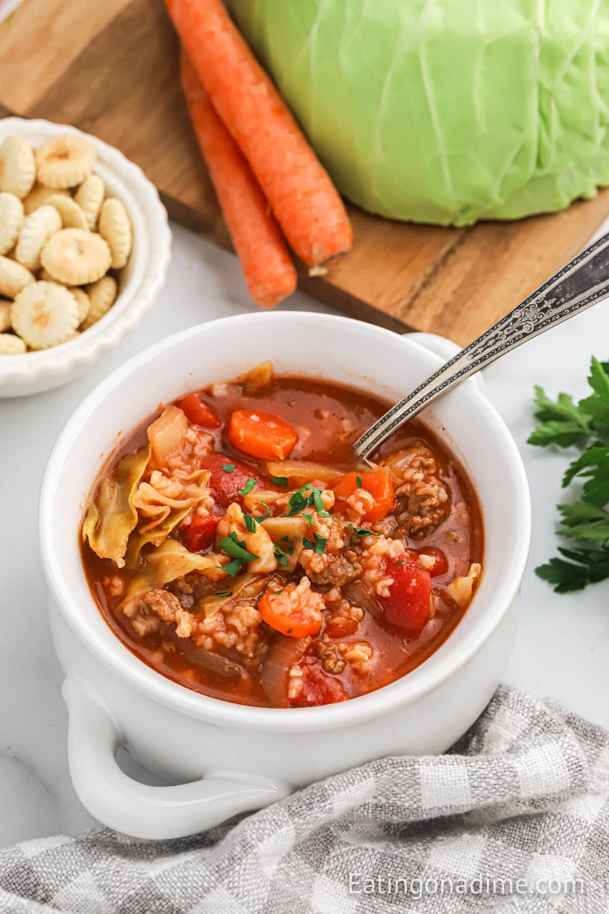 Cabbage Soup in a white bowl with a spoon