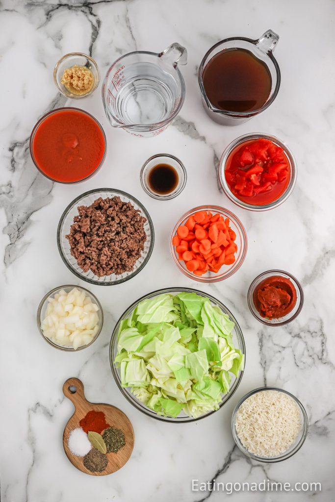 Ingredients needed - ground beef, onion, garlic, cabbage, beef broth, tomato sauce, carrots, bay leaf, brown sugar, salt and pepper, oregano leaves, rice