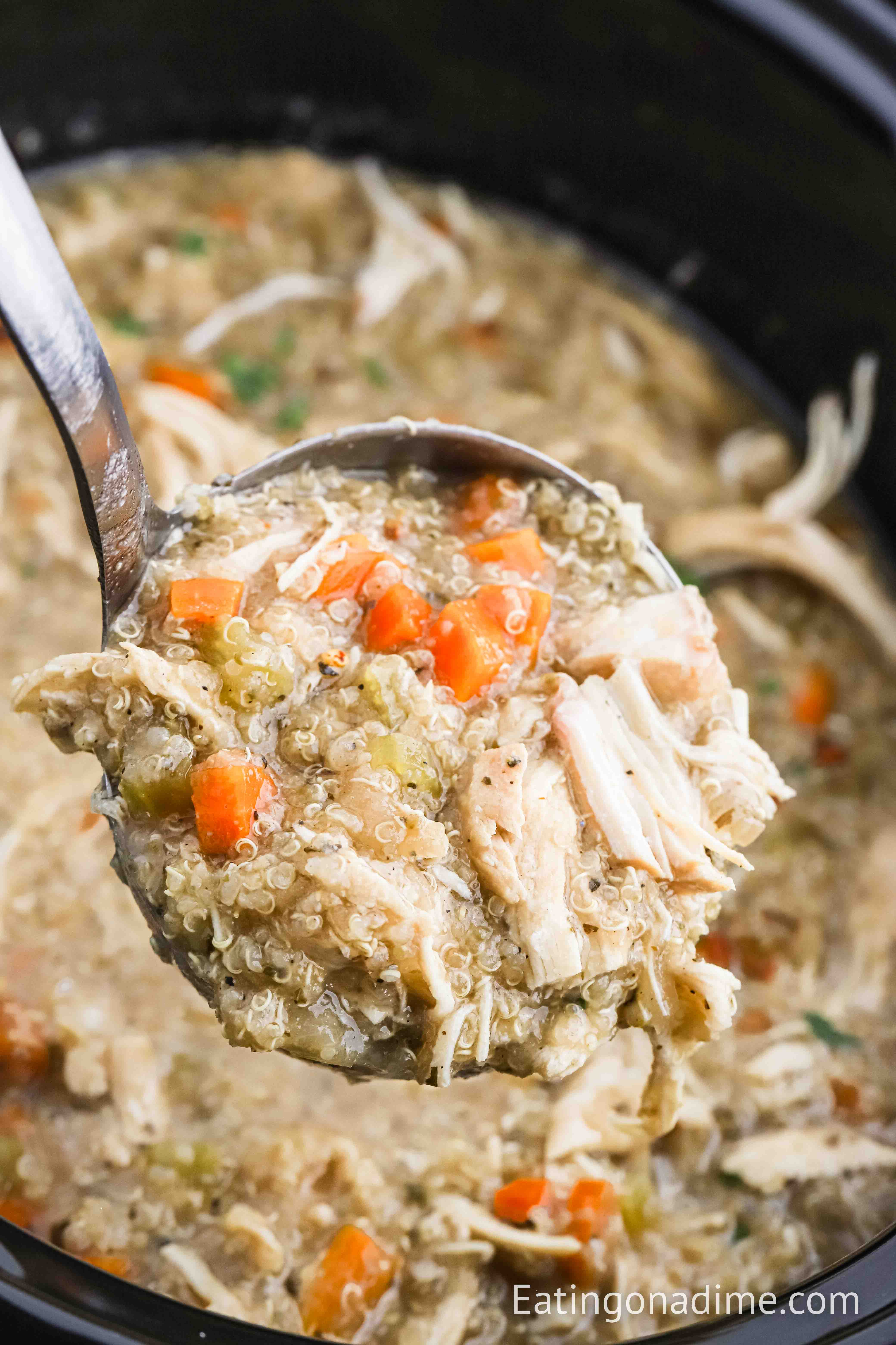 close up image of chicken quinoa soup on the ladle