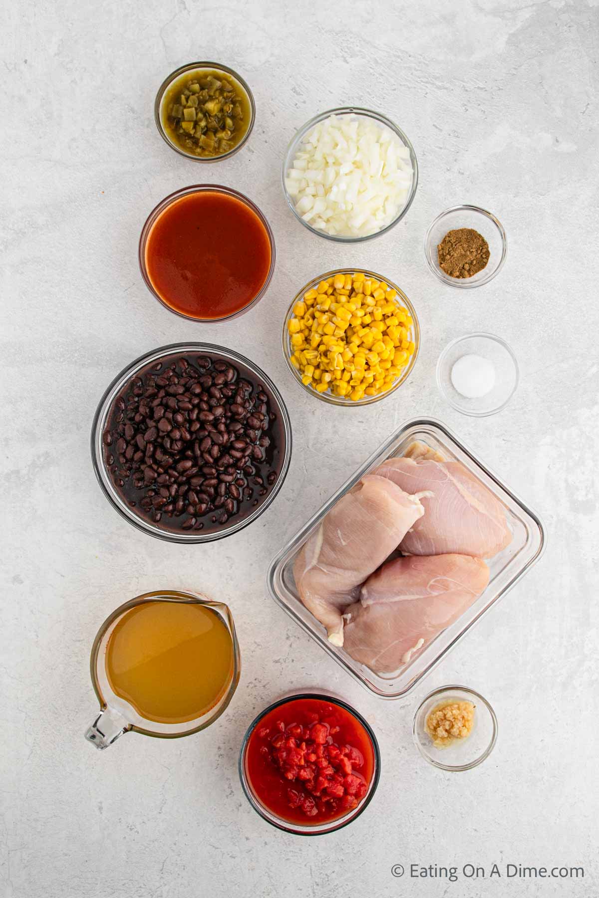 Chicken Enchilada Soup Ingredients - chicken breasts, chicken stock, red enchilada sauce, black beans, diced tomatoes, corn, green chilies, garlic, onion, cumin, salt