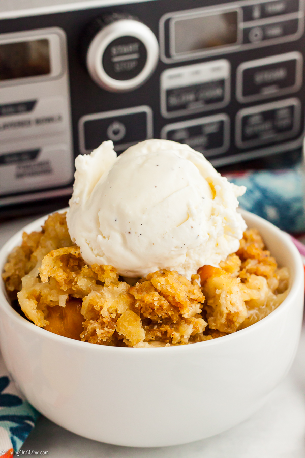 Crock pot peach dump cake is decadent and tasty for the perfect dessert without any work. With only 3 ingredients, enjoy peach dump cake recipe any day of the week!