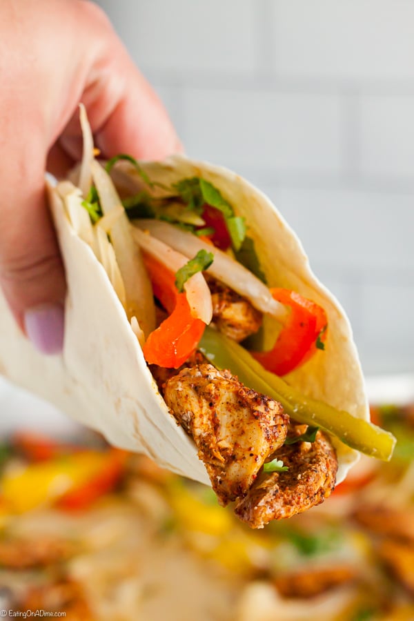 Sheet Pan Chicken Fajitas only takes a few ingredients and less than 25 minutes. Enjoy this delicious chicken mixture with tortillas or serve it alone.