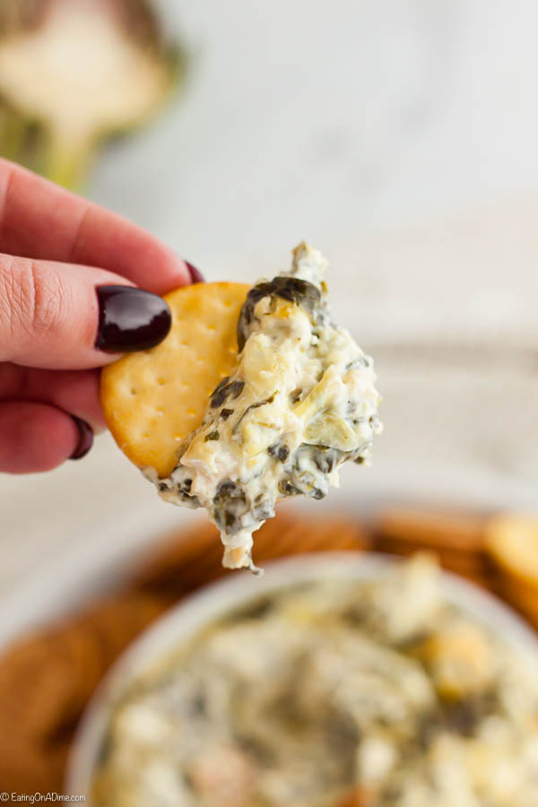 Spinach artichoke dip recipe is a classic and delicious recipe perfect for parties. This easy simple dip is so creamy and very easy to make. Try Spinach artichoke dip easy recipe for the best dip that is hot and cheesy. #eatingonadime #spinachartichokedipeasybaked