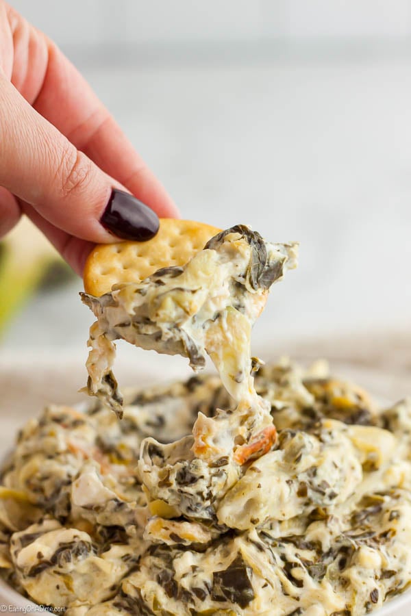 Spinach artichoke dip recipe is a classic and delicious recipe perfect for parties. This easy simple dip is so creamy and very easy to make. Try Spinach artichoke dip easy recipe for the best dip that is hot and cheesy. #eatingonadime #spinachartichokedipeasybaked