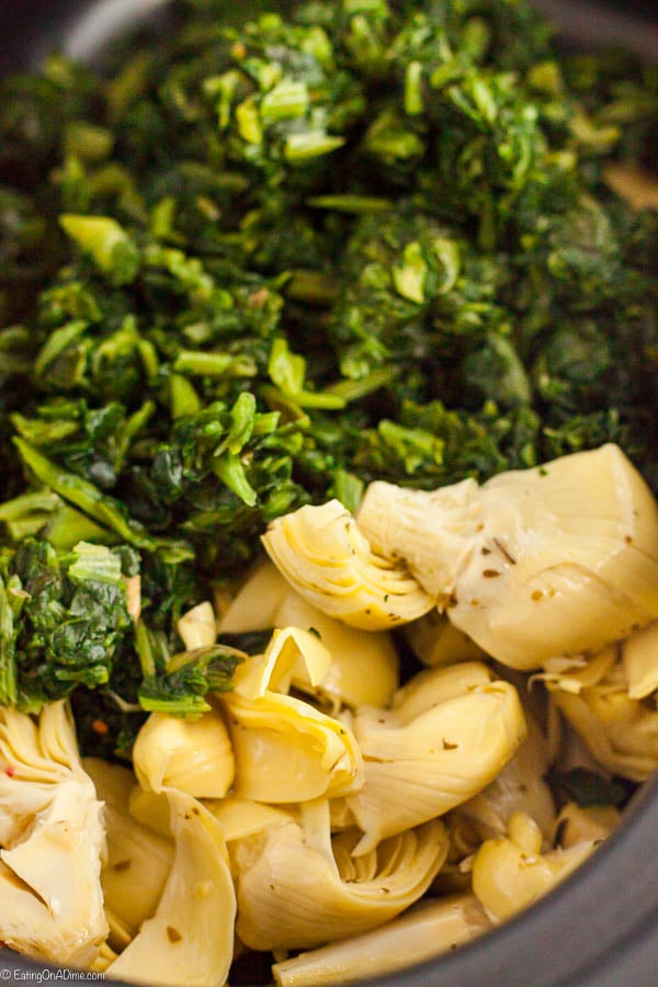 Adding spinach and artichoke to the slow cooker