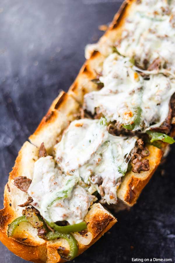This amazing Philly Cheesesteak Stuffed French Bread Recipe is so cheesy and stuffed with tons of flavor. Plus, this delicious meal takes just minutes. 