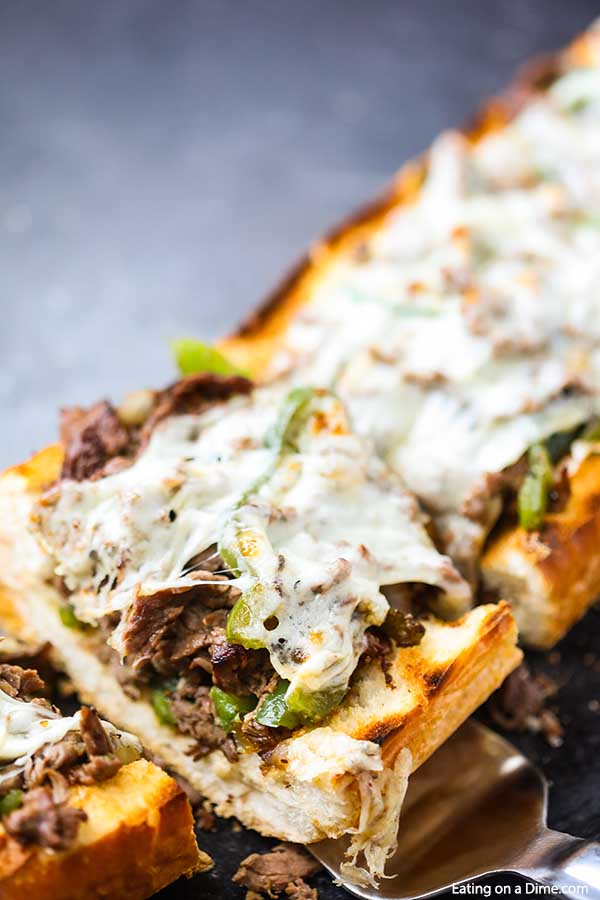 This amazing Philly Cheesesteak Stuffed French Bread Recipe is so cheesy and stuffed with tons of flavor. Plus, this delicious meal takes just minutes. 