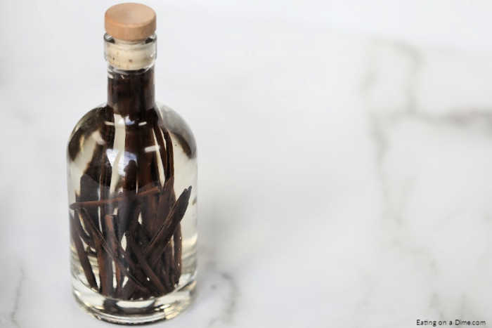 Learn how to make vanilla extract at home with vodka. Homemade DIY vanilla extract only takes 2 ingredients and 4 steps. It's easy to make and tastes amazing! #eatingonadime #DIYvanillaextract #homemadevanillaextract 