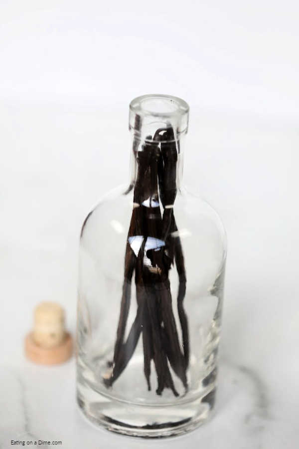 Learn how to make vanilla extract at home with vodka. Homemade DIY vanilla extract only takes 2 ingredients and 4 steps. It's easy to make and tastes amazing! #eatingonadime #DIYvanillaextract #homemadevanillaextract 