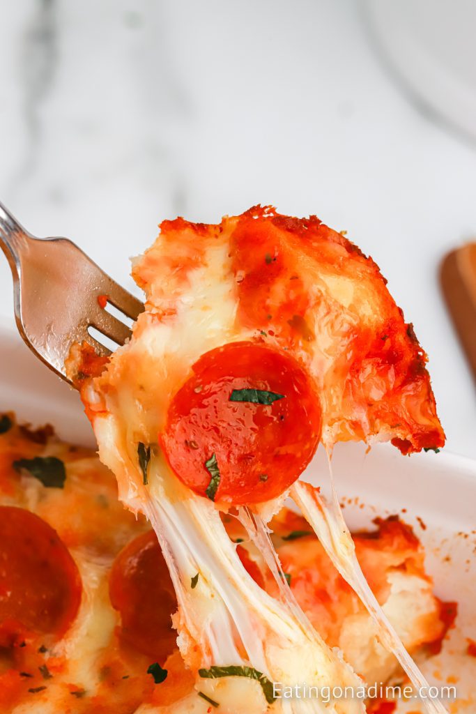 a bite of bubble pizza on a fork