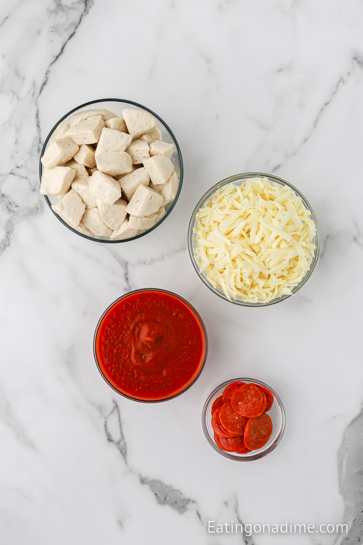 Ingredients needed - canned biscuits, pizza sauce, mozzarella cheese, pepperoni