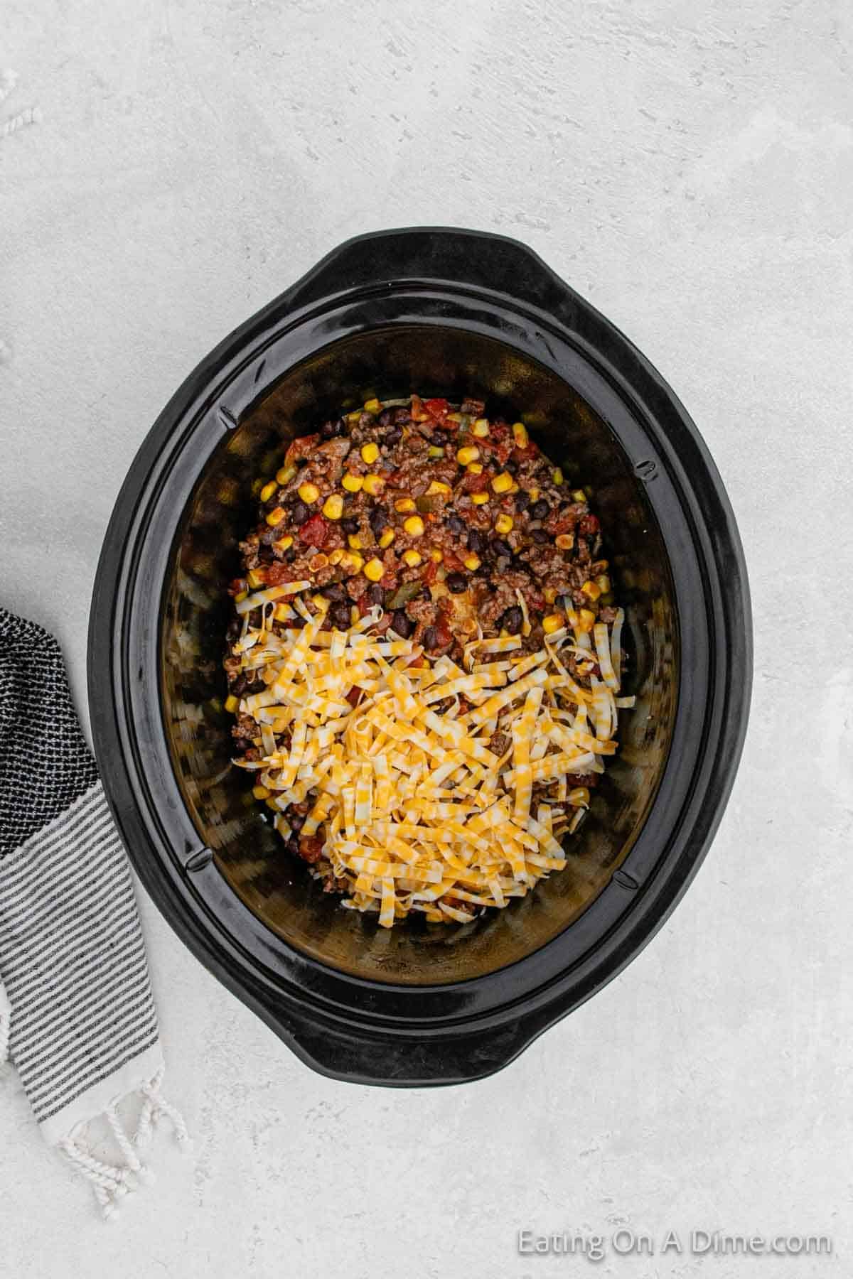 Layering the ingredients in the slow cooker