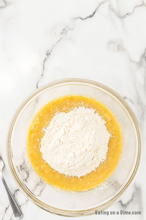 Adding the flour to the banana mixture