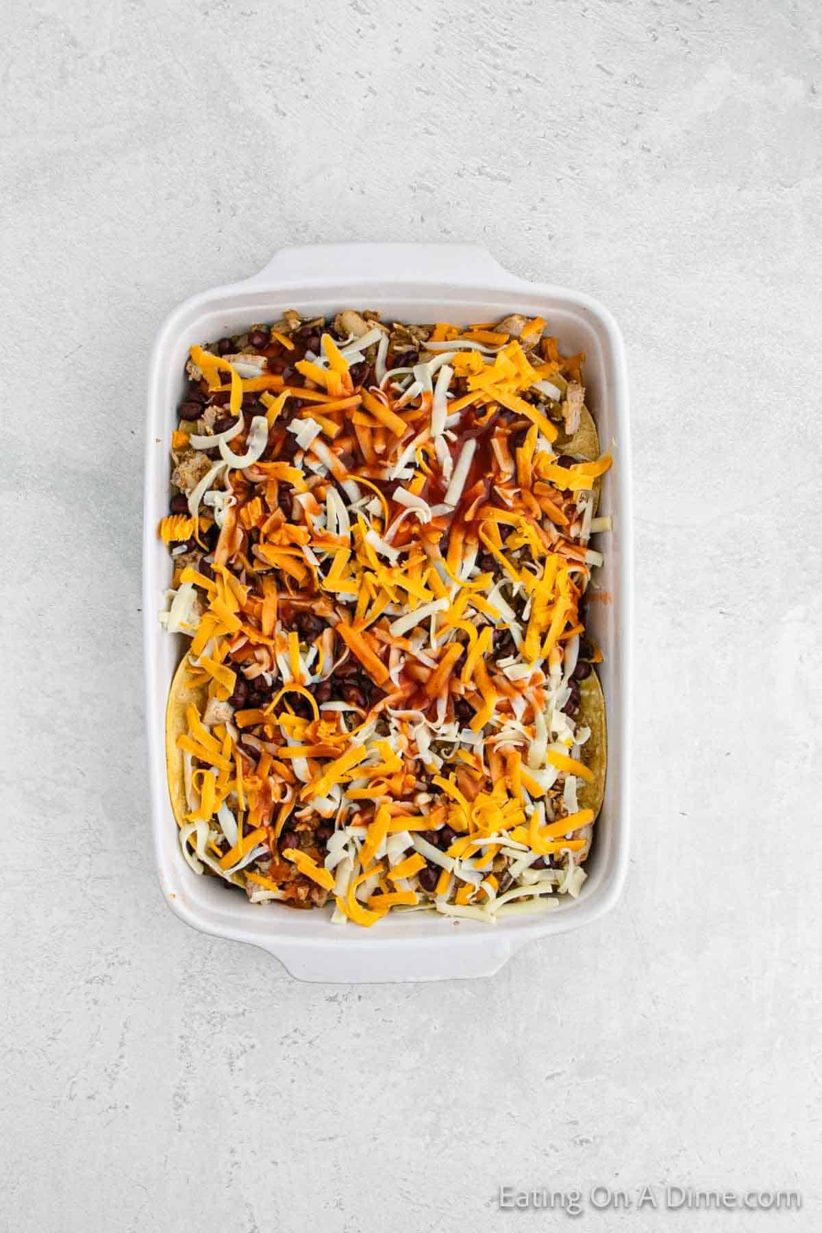 Topping with more shredded cheese