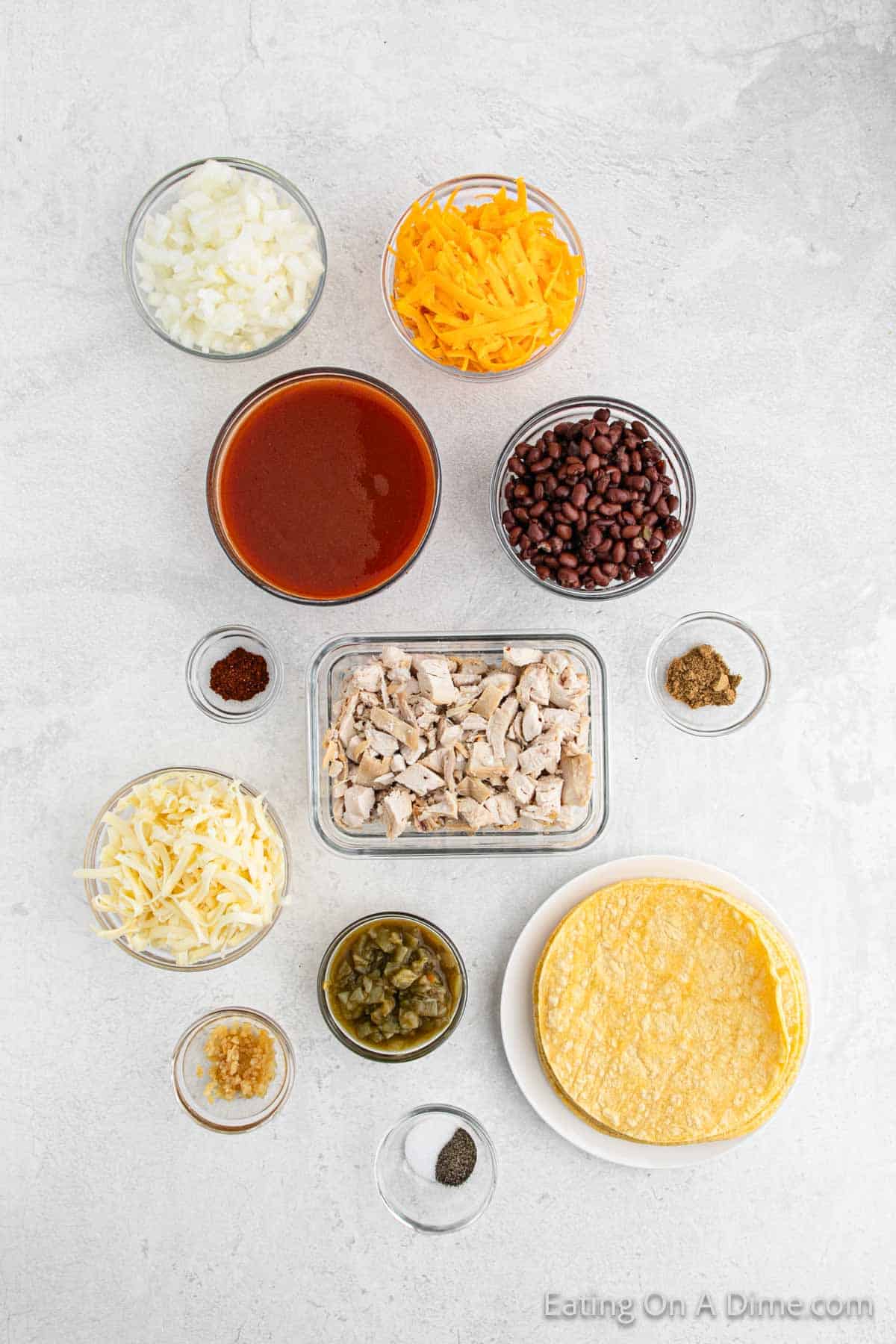 Chicken enchilada ingredients - chicken breasts, corn tortillas, enchilada sauce, cheese