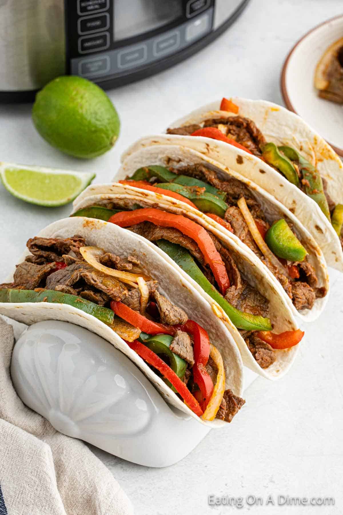 Close up image of steak fajitas in a taco steak