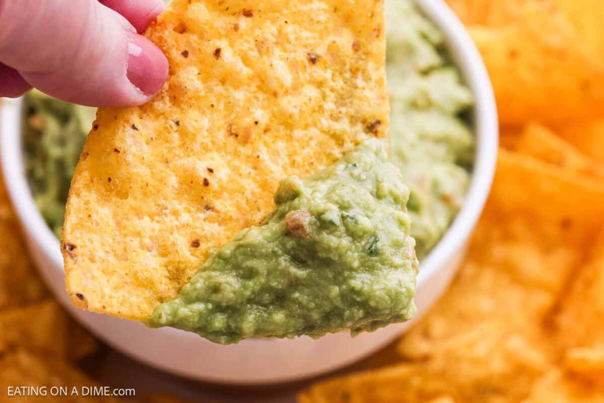Tortilla chip dipped into the dip.