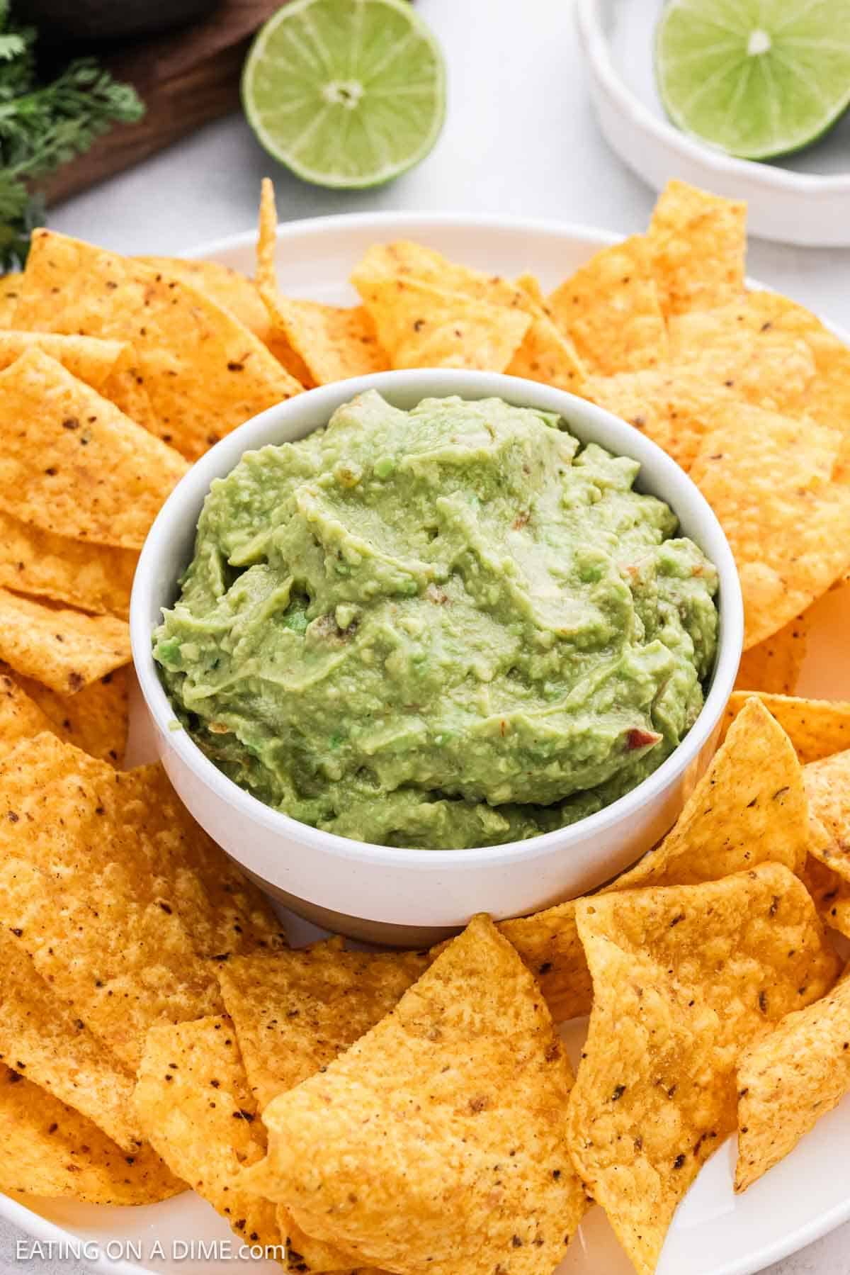 Ready to serve dip in a bowl with tortilla chips surrounding the bowl.