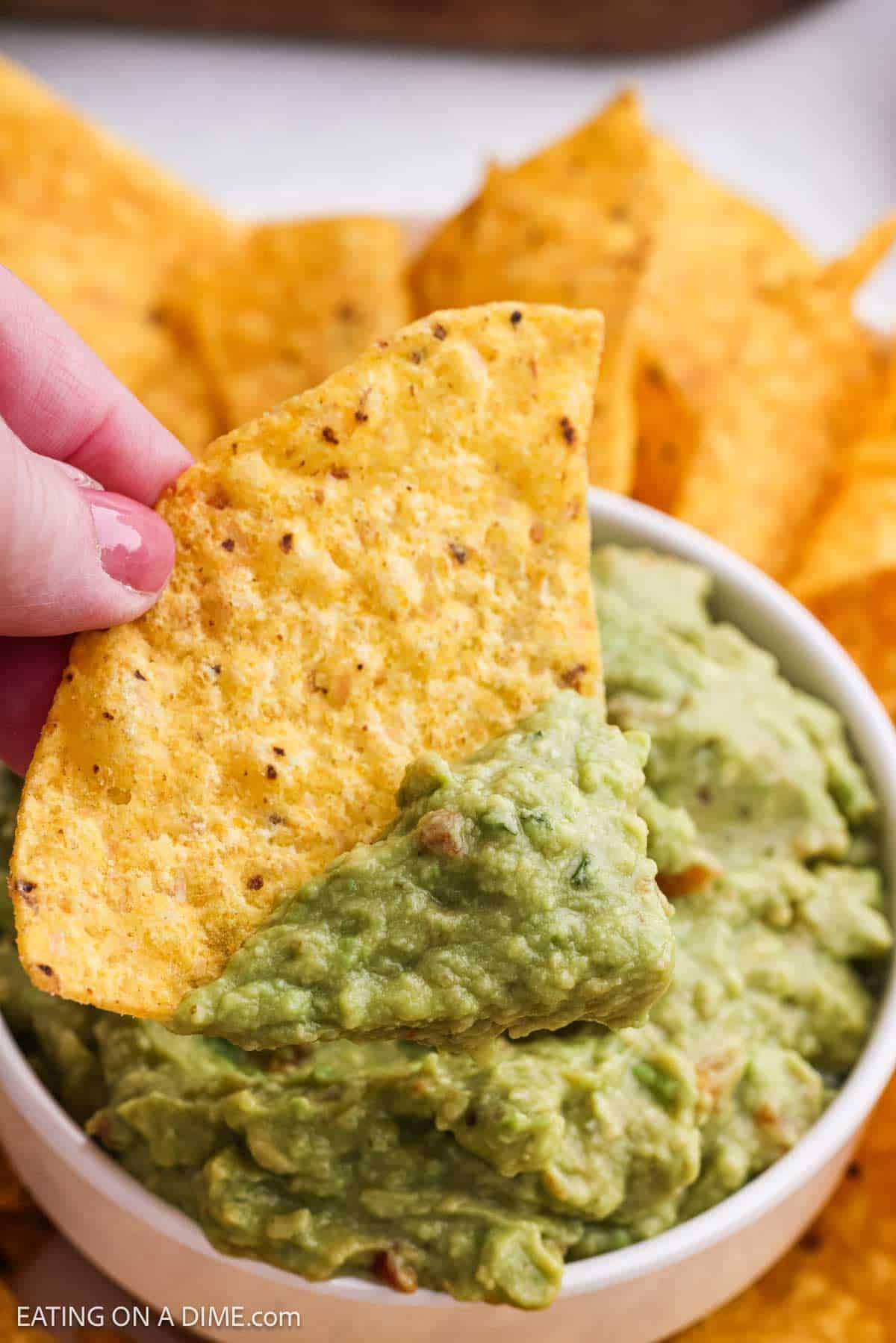 Tortilla chips topped with the dip.
