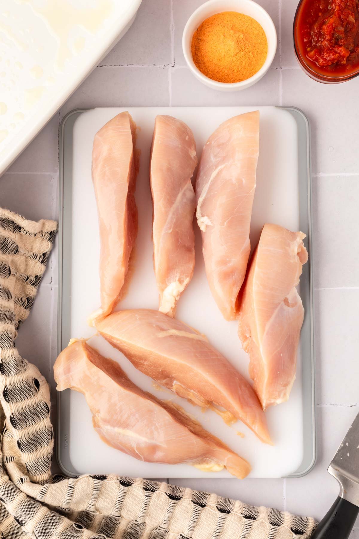 Slicing chicken on a cutting board