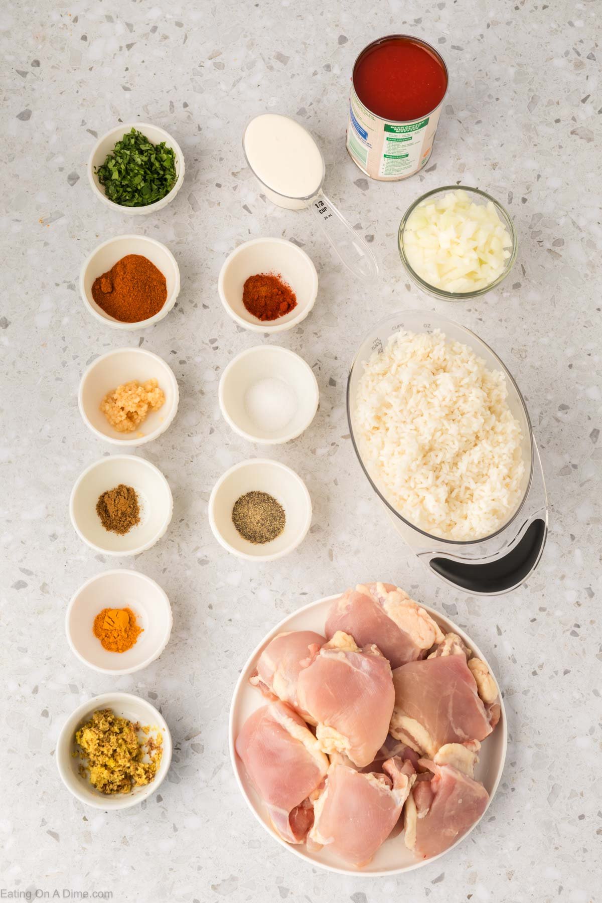 Ingredients - chicken thighs, garam marsala, cumin, turmeric, paprika, salt and pepper, onion, garlic, ginger, tomato sauce, heavy cream, rice, cilantro
