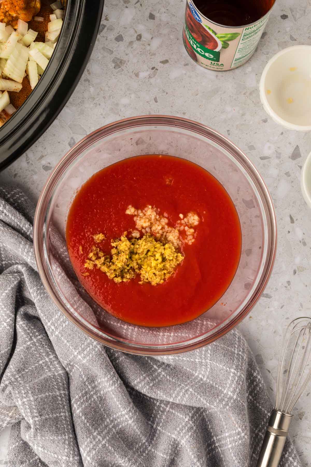 Combining the sauce with the seasoning in a bowl