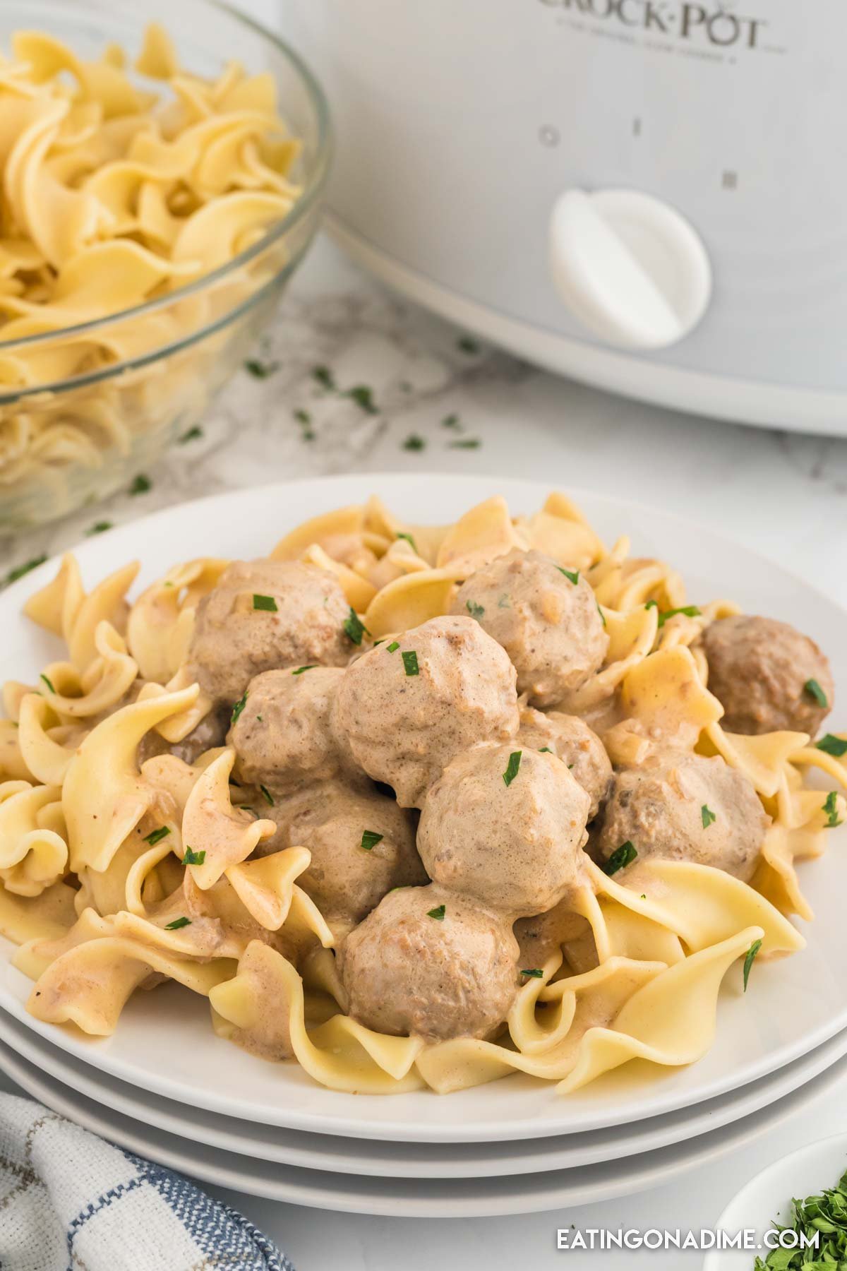 A plate of swedish meatballs over egg noodles