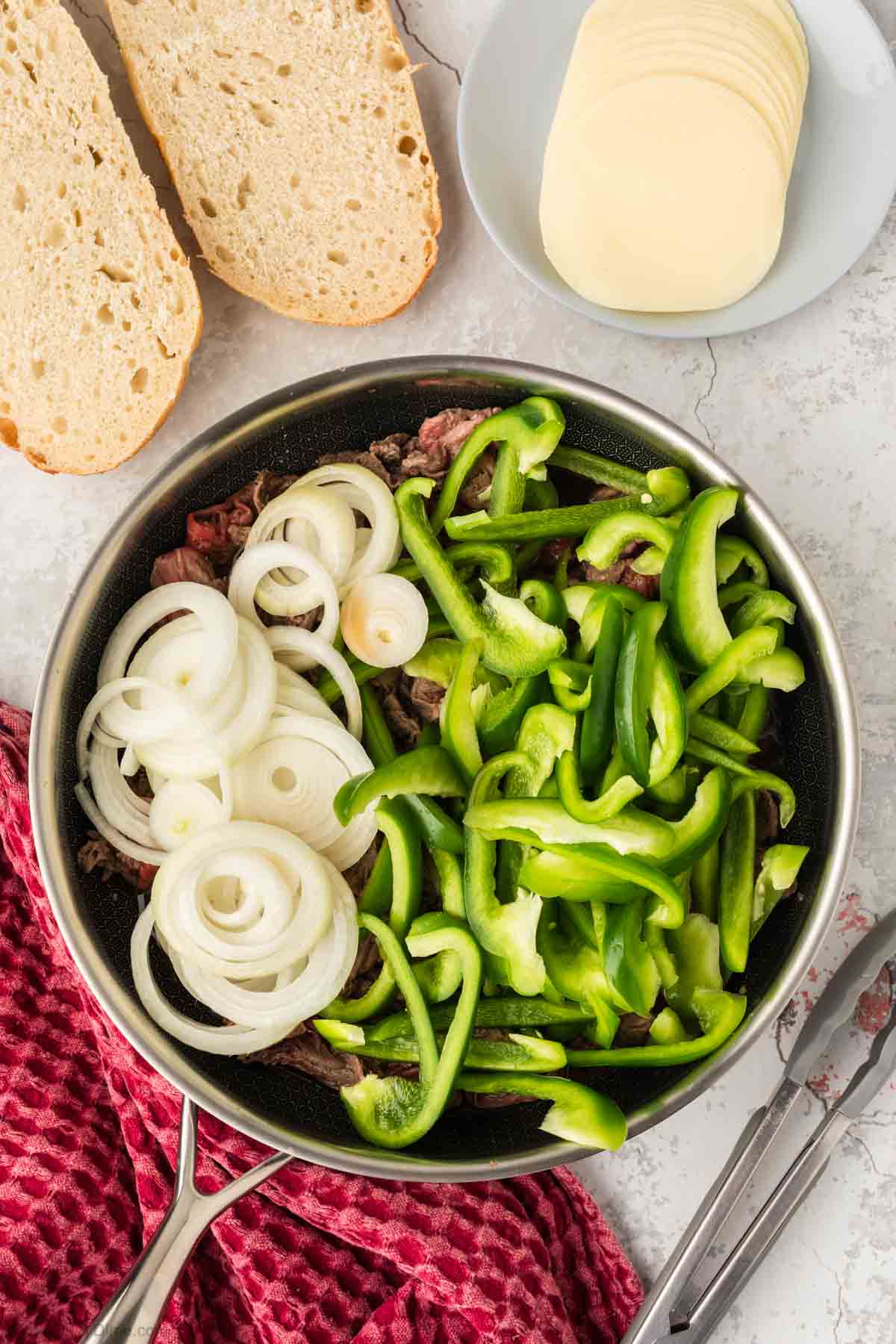 Cooking the veggies and steak in a skillet