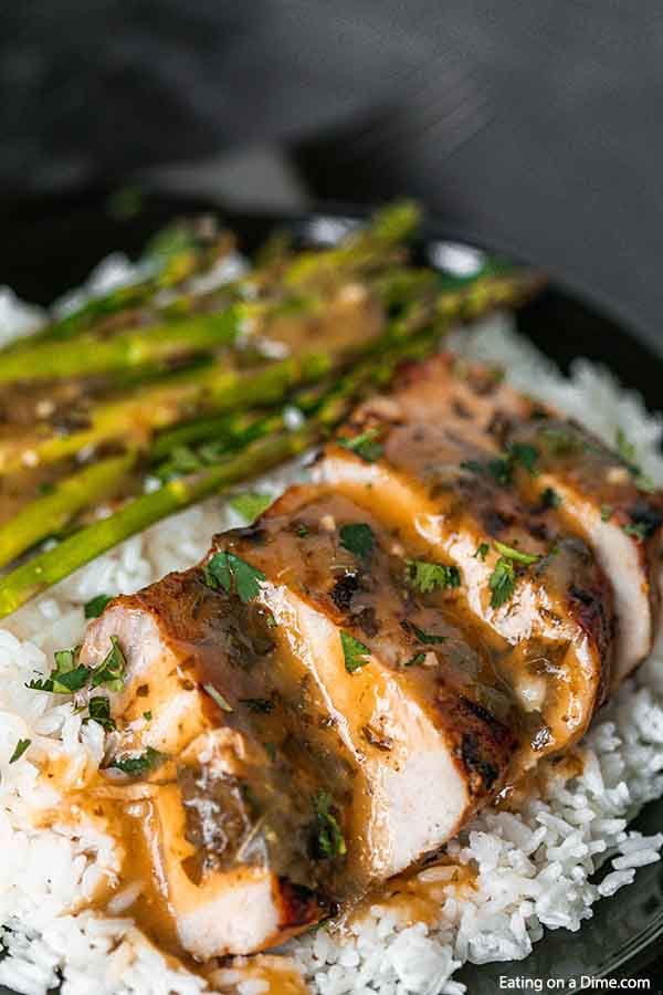 Crock Pot Cuban Mojo Pork Tenderloin recipe is the perfect dinner idea. The pork is loaded with citrus flavor and the best sauce to serve over rice. 