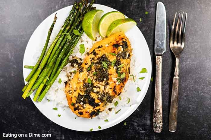 Mojo Chicken Recipe is a delicious citrus infused recipe served over rice with your favorite vegetable. The slow cooker makes this meal effortless.