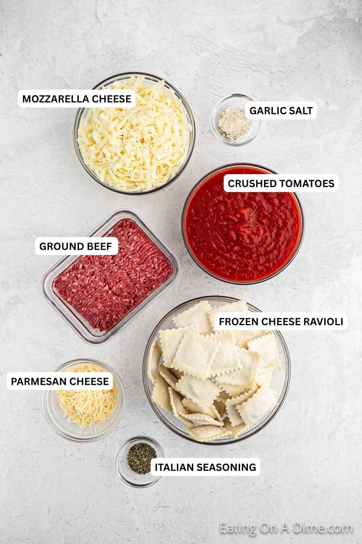 Ingredients needed for recipe: Italian seasoning, Parmesan cheese, frozen cheese ravioli, ground beef, crushed tomatoes, garlic salt and Mozzarella cheese.
