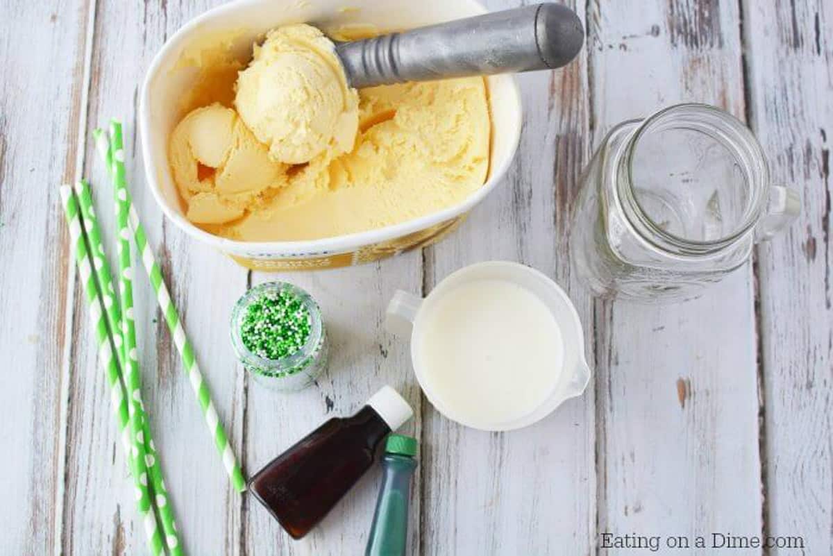Shamrock Shake ingredients - vanilla ice cream, milk, mint extract, green food coloring, whipped cream, sprinkles