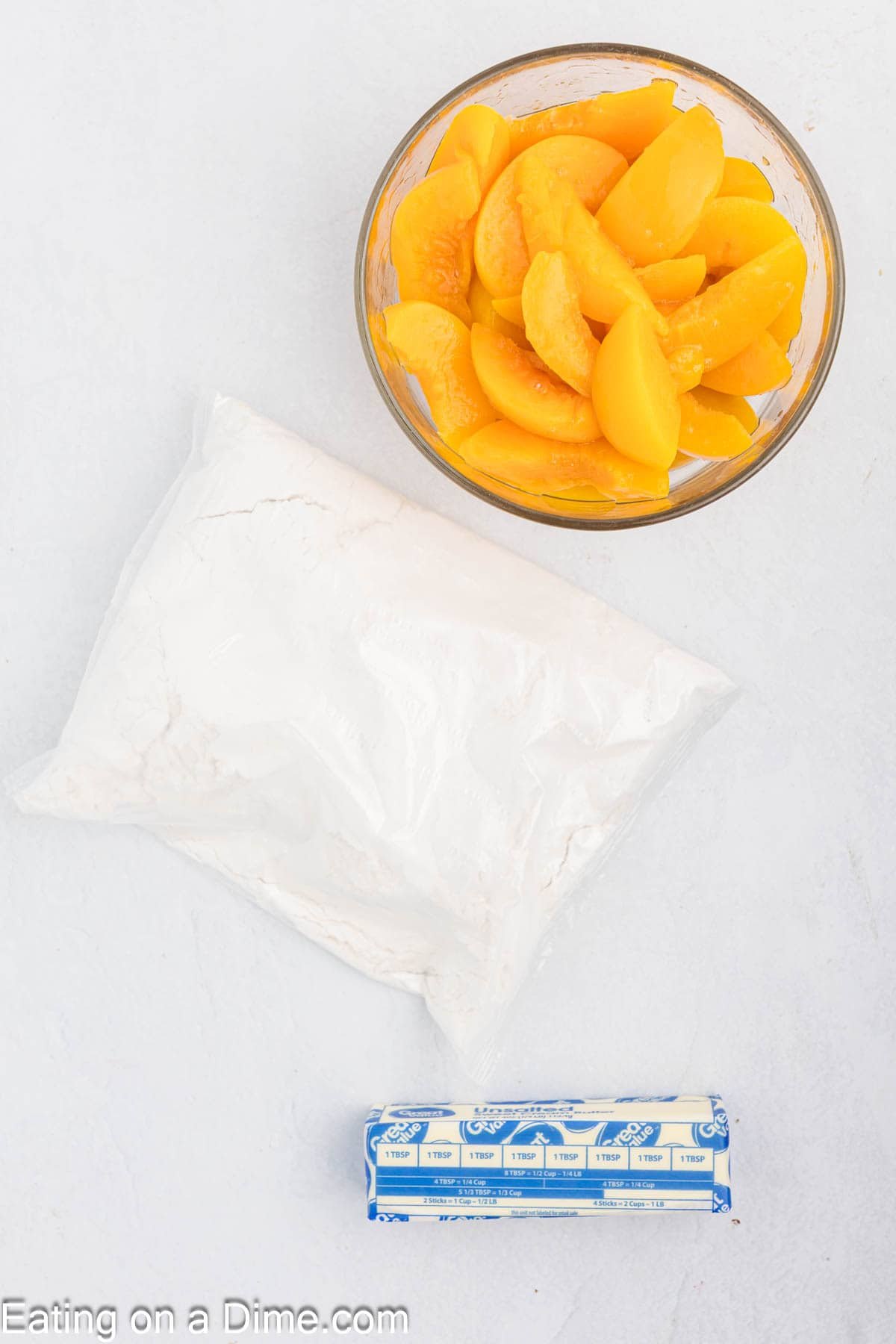 Ingredients - Canned peaches, cake mix, and stick of butter