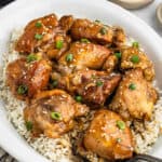Chicken thighs with rice and sesame seeds.
