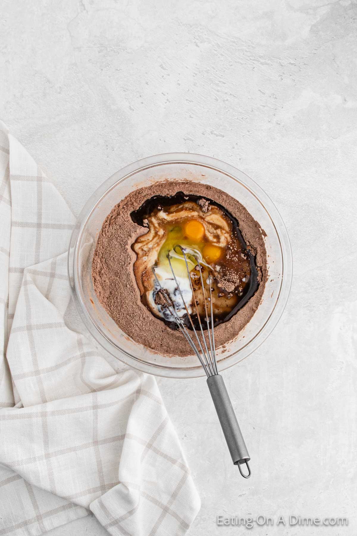 Combining the wet ingredients and dry ingredients together in a bowl